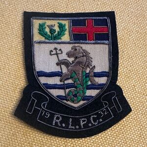 Ralph Lauren crest patch made with bullion wire. Hand stitched